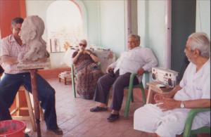 Pu La Deshpande and Sunitabai with Ram Kolatkar near Pu La's portrait.